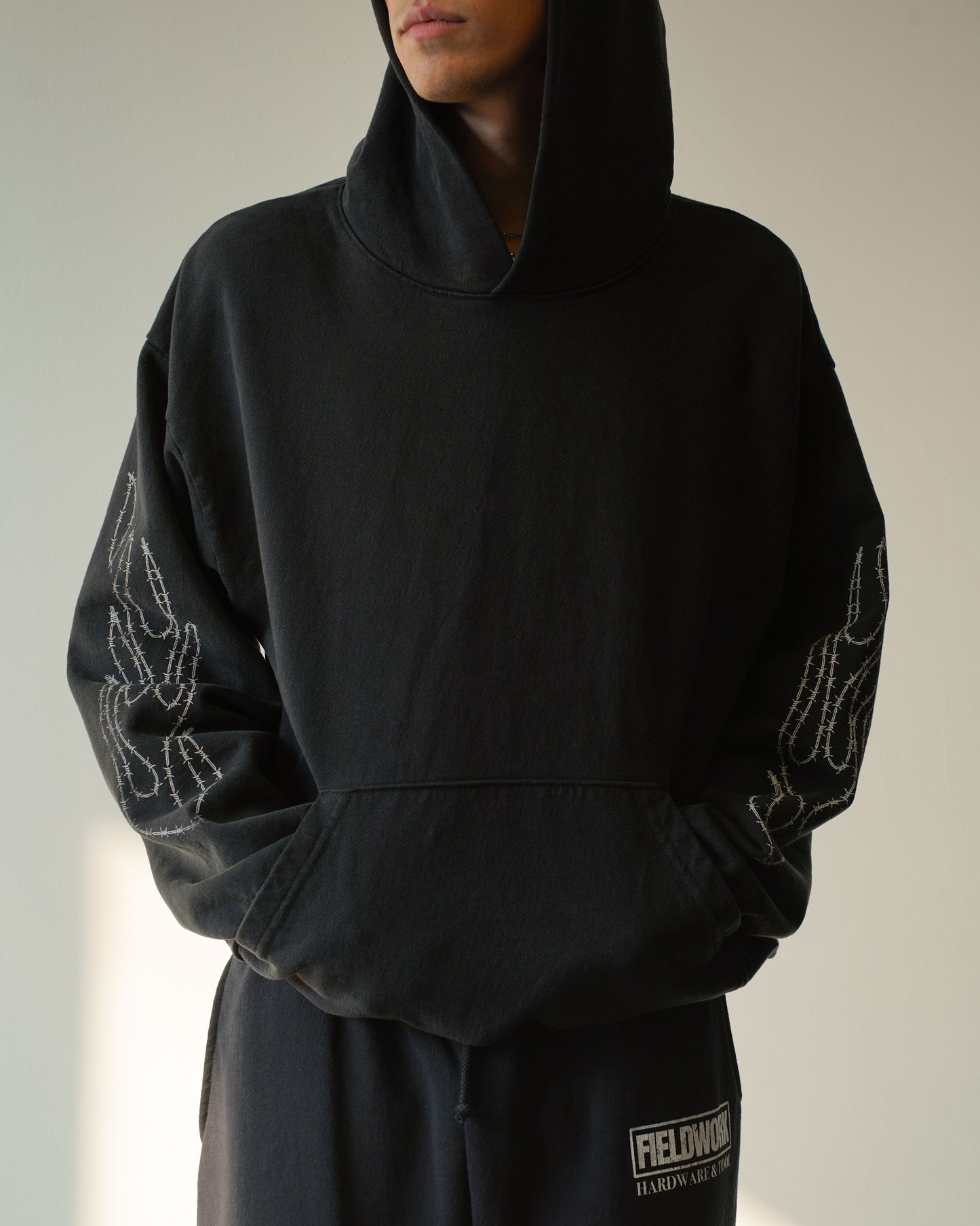 TRESPASSER HOODIE (COAL)